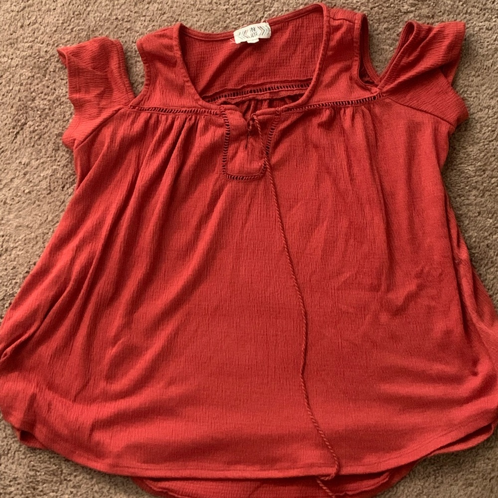cut off shoulder shirt with short sleeves.